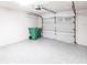 Spacious two car garage with speckled epoxy floor and automatic door at 11176 3Rd Ave, Punta Gorda, FL 33955