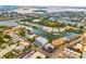 Expansive aerial view showcasing the waterfront community, waterways and lush landscapes at 11723 1St E St, Treasure Island, FL 33706