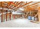 Unfinished attic space showing rafters, insulation, ductwork, and suitcases in a residential home at 11723 1St E St, Treasure Island, FL 33706