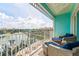 Relax on this spacious balcony with plush seating and serene water views at 11723 1St E St, Treasure Island, FL 33706