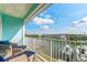 Enjoy stunning waterfront views from this spacious balcony with comfortable seating at 11723 1St E St, Treasure Island, FL 33706