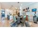 Inviting dining area featuring stylish decor, modern lighting, and an open-concept layout at 11723 1St E St, Treasure Island, FL 33706