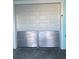 Garage door with a flood barrier for protection from possible flooding at a residential home at 11723 1St E St, Treasure Island, FL 33706