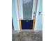 Exterior shot of a door with yellow and blue flood protection barrier at a residential home at 11723 1St E St, Treasure Island, FL 33706