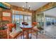 Cozy breakfast nook with a view of the water, enhanced by natural light and quaint decor at 1200 Winward Ct, Punta Gorda, FL 33950