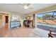 Bright home office featuring a desk, sliding glass doors, and views of the pool at 1200 Winward Ct, Punta Gorda, FL 33950