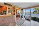 Transitional area connecting the kitchen to the sunroom, offering both convenience and scenic views at 1200 Winward Ct, Punta Gorda, FL 33950