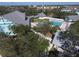 Aerial view of a community pool surrounded by trees at 1286 Green Oak Trl, Port Charlotte, FL 33948