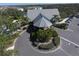 Aerial view of a community clubhouse featuring manicured landscaping at 1286 Green Oak Trl, Port Charlotte, FL 33948