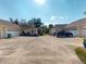 A driveway leading up to two residences with garages and front lawns at 1286 Green Oak Trl, Port Charlotte, FL 33948