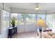 Sunroom surrounded by large windows for natural light at 1286 Green Oak Trl, Port Charlotte, FL 33948