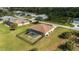 Aerial view of a home with lush landscaping, spacious backyard and large pool at 13157 Ridgely Cir, Port Charlotte, FL 33981