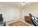 Bedroom includes a closet, ceiling fan, and tiled floors, ensuring a clean and comfortable living area at 13157 Ridgely Cir, Port Charlotte, FL 33981