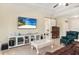 Inviting living room with a large TV, beach view, and comfortable seating at 13157 Ridgely Cir, Port Charlotte, FL 33981