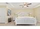 Serene main bedroom features a ceiling fan, tile floors, and a comfortable bed at 13157 Ridgely Cir, Port Charlotte, FL 33981