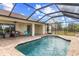 Screened in Pool, paved patio, and outdoor seating at 13157 Ridgely Cir, Port Charlotte, FL 33981