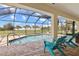 Screened-in pool and brick patio perfect for enjoying sunny days and relaxation at 13157 Ridgely Cir, Port Charlotte, FL 33981