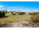 The spacious backyard of the house with a lush green lawn at 1364 Ultramarine Ln, Punta Gorda, FL 33983