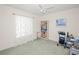 Spacious bedroom featuring a ceiling fan, window, and a bookshelf at 1364 Ultramarine Ln, Punta Gorda, FL 33983