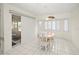 Bright dining area featuring tile floors, shuttered windows, and sliding glass door with outdoor view at 1364 Ultramarine Ln, Punta Gorda, FL 33983