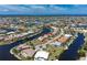 Wide aerial view showing a canal-front home in a waterfront neighborhood at 1453 Wren Ct, Punta Gorda, FL 33950