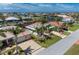 Low aerial of a single-Gathering home and its private boat dock along the canal at 1453 Wren Ct, Punta Gorda, FL 33950