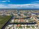 Expansive aerial shot showcasing a waterfront canal community with lush landscaping at 1453 Wren Ct, Punta Gorda, FL 33950