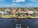 Waterfront home with a private dock and pool, surrounded by lush landscaping and beautiful canal views at 1453 Wren Ct, Punta Gorda, FL 33950