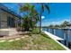 Lush backyard view shows canal access and a peaceful outdoor setting, perfect for waterfront living at 1453 Wren Ct, Punta Gorda, FL 33950