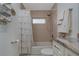 Well-lit bathroom featuring a shower over the bath and neutral tile at 1453 Wren Ct, Punta Gorda, FL 33950