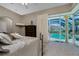 Bedroom with a view of the pool and lanai through sliding glass doors at 1453 Wren Ct, Punta Gorda, FL 33950