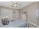 Comfortable bedroom showcasing a cozy bed, a dresser, and a closet with mirrored doors at 1453 Wren Ct, Punta Gorda, FL 33950