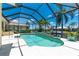 Screened pool with lush landscaping, perfect for relaxation and enjoying the Florida lifestyle with access to the canal at 1453 Wren Ct, Punta Gorda, FL 33950