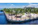 Aerial view of an outdoor beach bar with colorful seating and palm trees at 150 Harborside Ave # 122, Punta Gorda, FL 33950