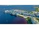 Aerial view of waterfront condos and a marina filled with boats at 150 Harborside Ave # 122, Punta Gorda, FL 33950