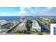 Waterfront condo complex with mature trees and a view of the bridge in a sunny location at 150 Harborside Ave # 122, Punta Gorda, FL 33950