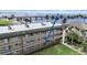 Aerial view of the multi-story condo complex near the water and bridge at 150 Harborside Ave # 122, Punta Gorda, FL 33950