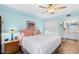 Comfortable main bedroom with ensuite bathroom, spacious closet, and soft blue paint at 150 Harborside Ave # 122, Punta Gorda, FL 33950