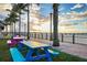 Vibrant waterfront outdoor dining area with colorful seating at 150 Harborside Ave # 122, Punta Gorda, FL 33950