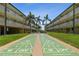 View of a Shuffleboard court with the building in the background at 150 Harborside Ave # 122, Punta Gorda, FL 33950