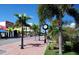 Street view with well-manicured landscaping, sidewalks, and street lamps at 150 Harborside Ave # 122, Punta Gorda, FL 33950