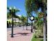 Street view with well-manicured landscaping, sidewalks, and street lamps at 150 Harborside Ave # 122, Punta Gorda, FL 33950