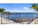 Scenic view of a bridge over the water with palm trees and a beautiful blue sky at 150 Harborside Ave # 122, Punta Gorda, FL 33950