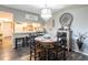 This dining area features a round wood table and chairs; a pass through to a kitchen is visible in the background at 1515 Forrest Nelson Blvd # D103, Port Charlotte, FL 33952