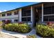 Exterior view of this condominium showing walkways and manicured landscaping at 1515 Forrest Nelson Blvd # D103, Port Charlotte, FL 33952