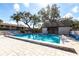 Inviting community pool featuring pristine waters, spacious deck, and comfortable lounge chairs at 1515 Forrest Nelson Blvd # D103, Port Charlotte, FL 33952