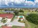 Expansive aerial view showing houses, a golf course, and a community pool at 1640 Atares Dr # 21, Punta Gorda, FL 33950