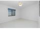 Bedroom with window and ceiling fan at 1640 Atares Dr # 21, Punta Gorda, FL 33950