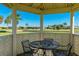 Relaxing outdoor gazebo overlooking the golf course with seating at 1640 Atares Dr # 21, Punta Gorda, FL 33950