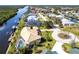 A neighborhood aerial view highlights waterfront living and pool home at 19179 Aviation Ct, Port Charlotte, FL 33948